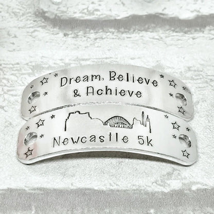 NEWCASTLE Skyline Trainer Tags