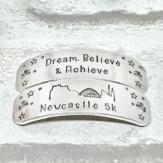 NEWCASTLE Skyline Trainer Tags