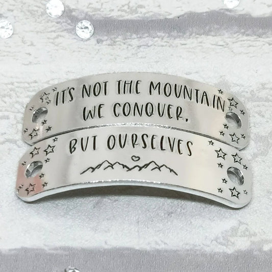 IT'S NOT THE MOUNTAIN WE CONQUER BUT OURSELVES Trainer Tags